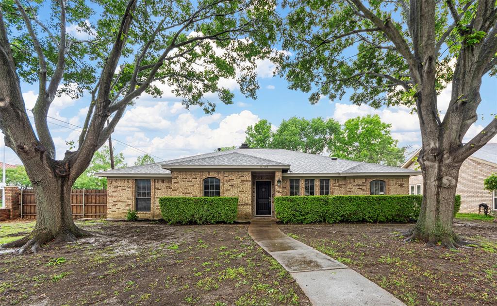 Single story home featuring fence, brick siding, and a shingled roof