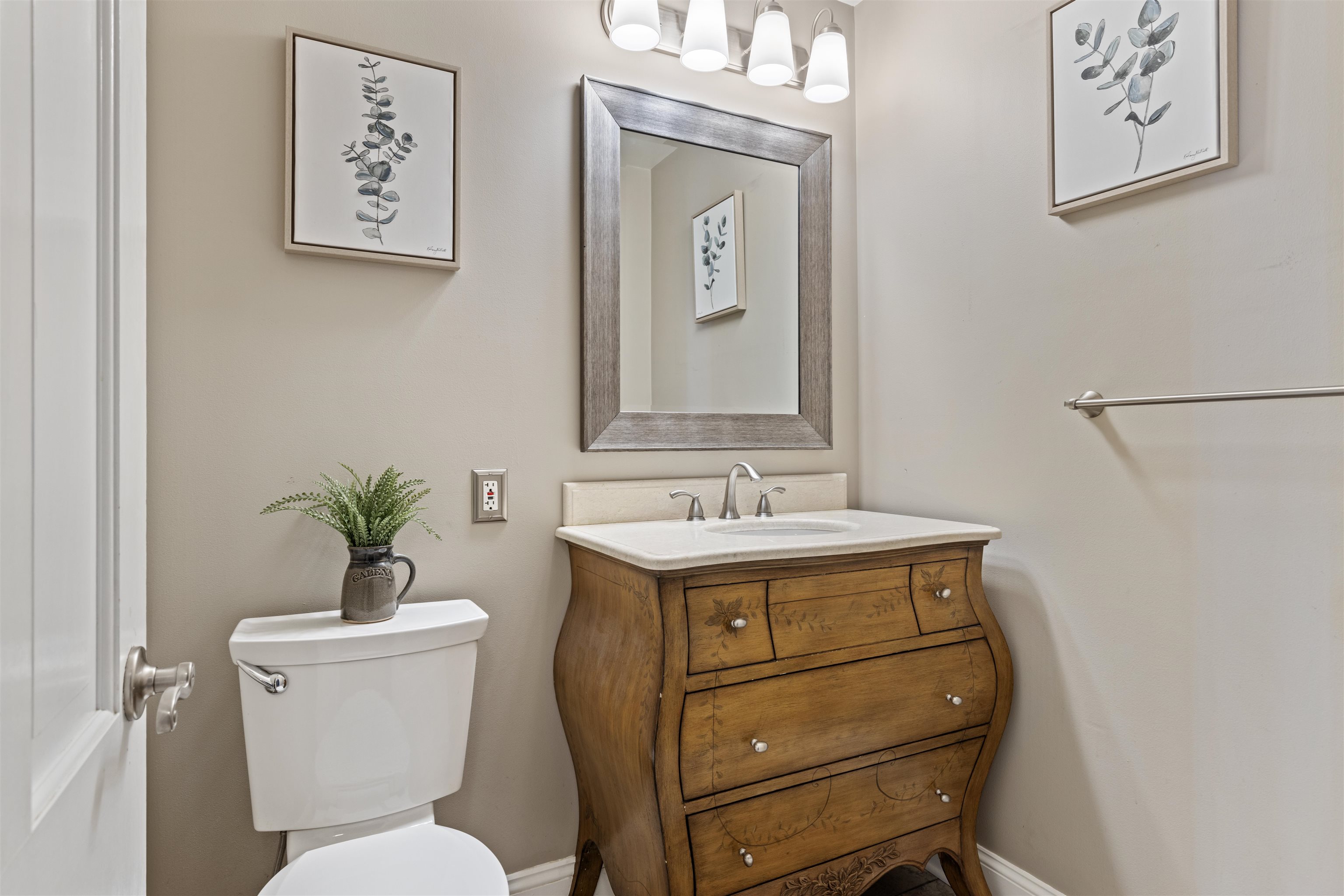 4976 Brigadoon Road Rockford, IL 61107 - Photo 12 of 32 a bathroom with a toilet sink and mirror
