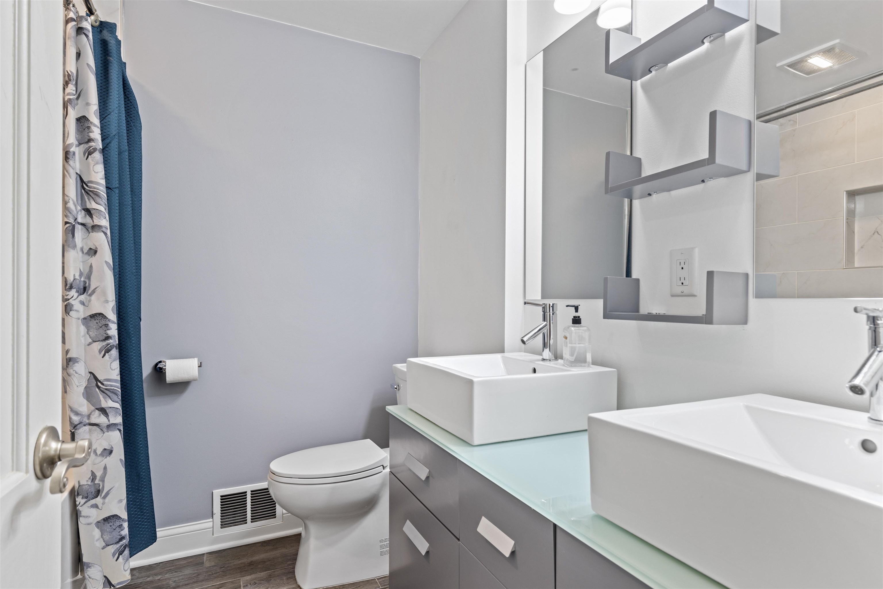4976 Brigadoon Road Rockford, IL 61107 - Photo 15 of 32 a bathroom with a sink a toilet and a mirror