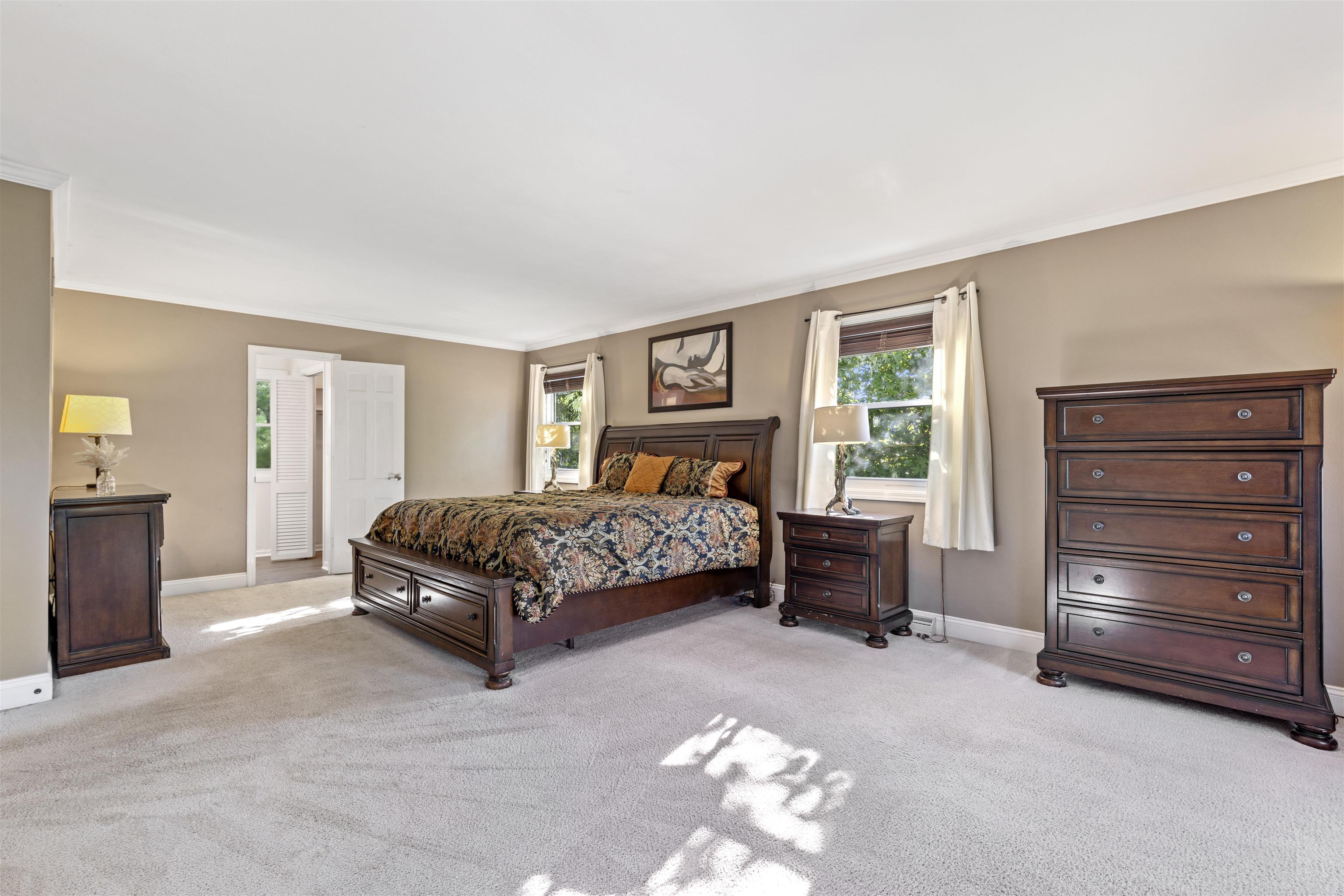 4976 Brigadoon Road Rockford, IL 61107 - Photo 19 of 32 a bedroom with a bed and a dresser