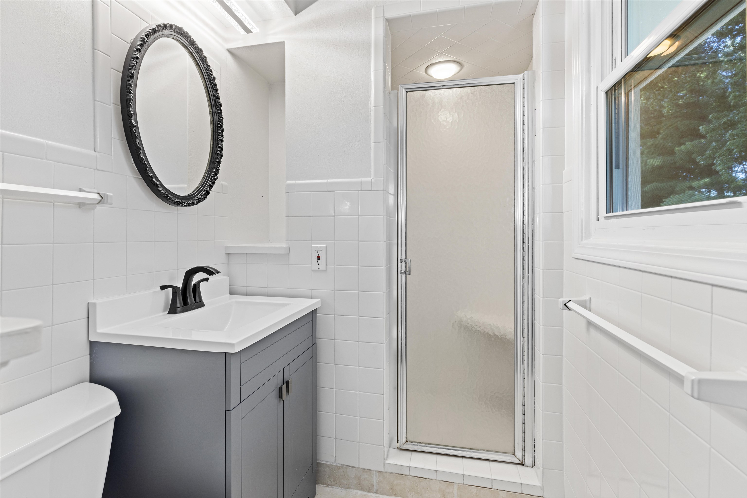 4976 Brigadoon Road Rockford, IL 61107 - Photo 21 of 32 a bathroom with a sink a toilet and a mirror