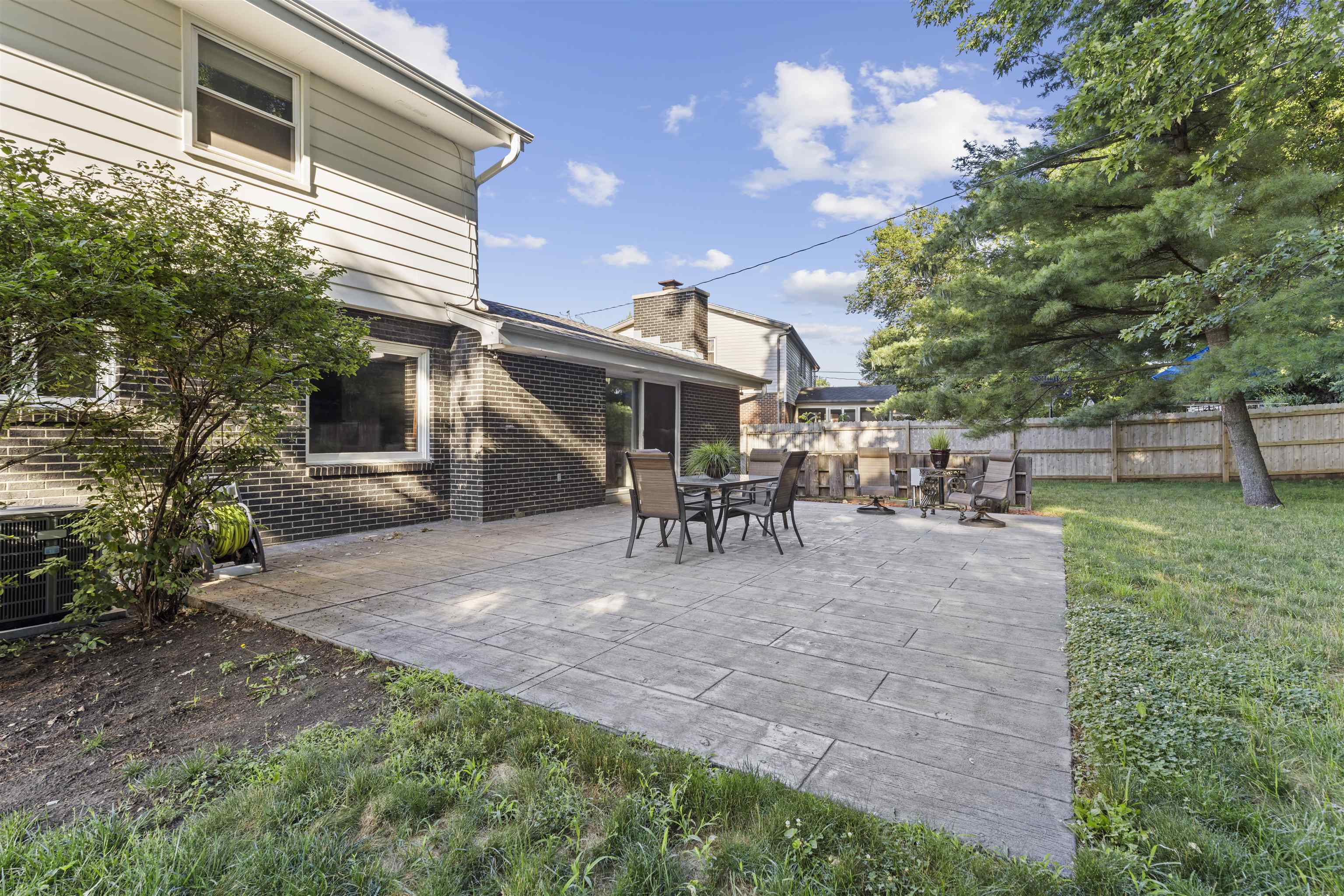 4976 Brigadoon Road Rockford, IL 61107 - Photo 29 of 32 a view of a house with backyard and a sitting area
