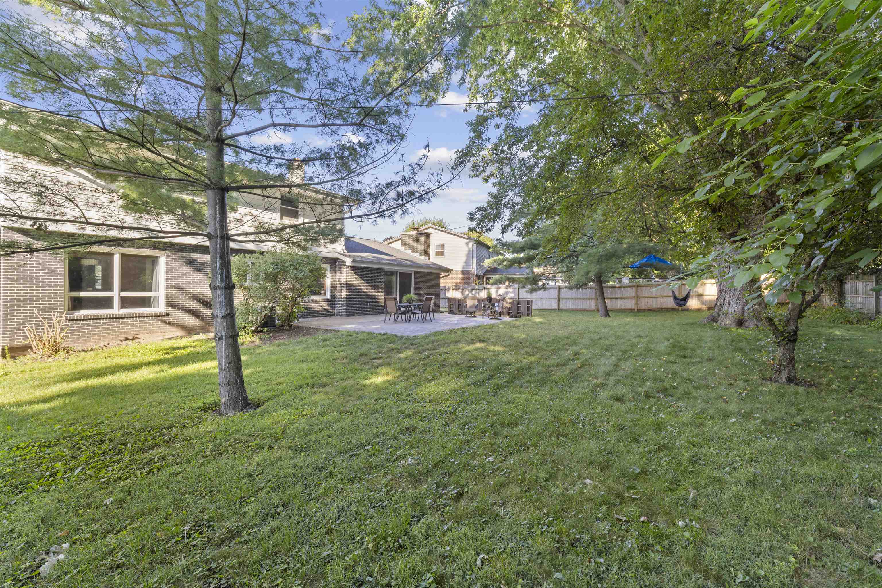 4976 Brigadoon Road Rockford, IL 61107 - Photo 31 of 32 a view of a house with a yard porch and sitting area