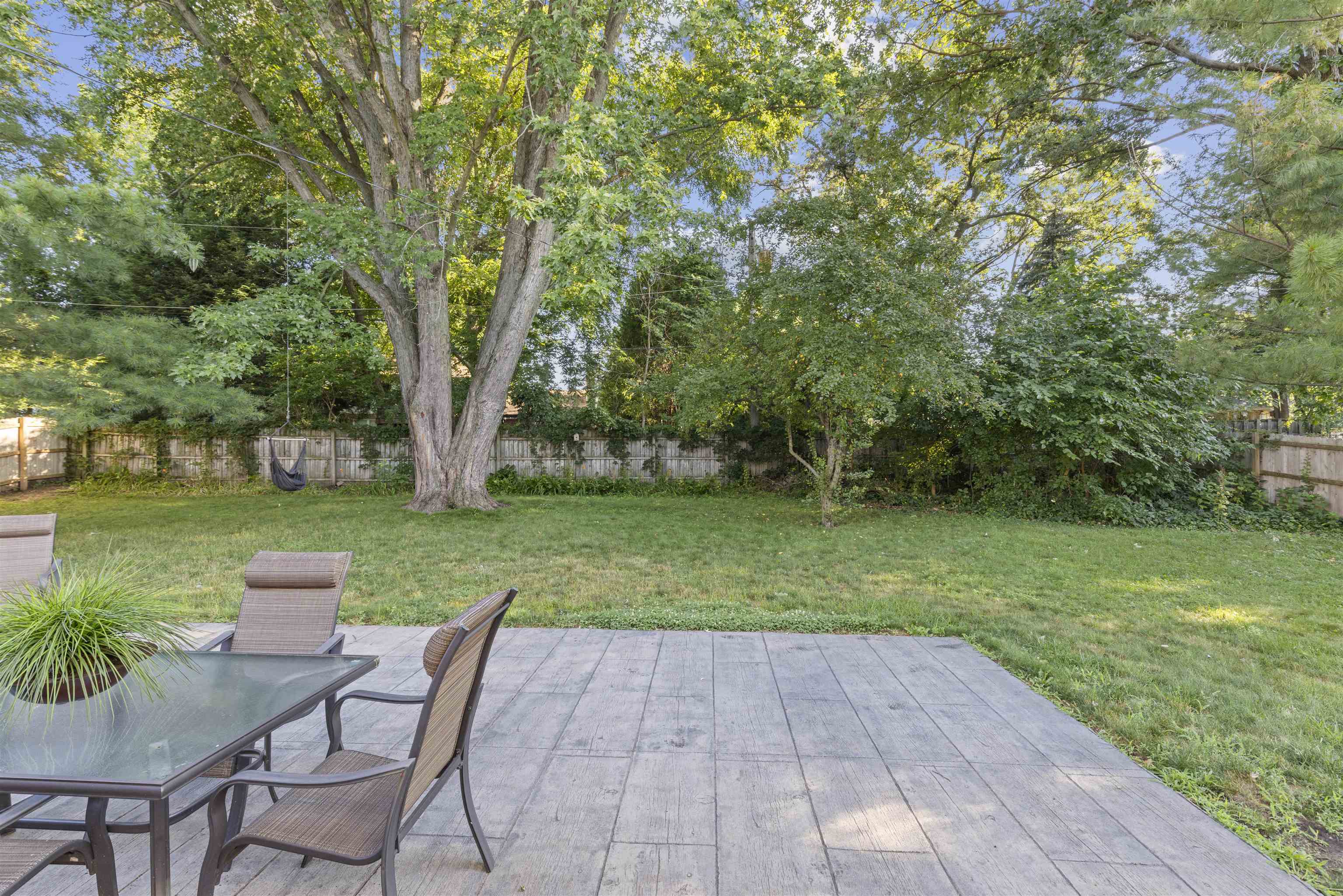 4976 Brigadoon Road Rockford, IL 61107 - Photo 32 of 32 a view of backyard with seating area and green space