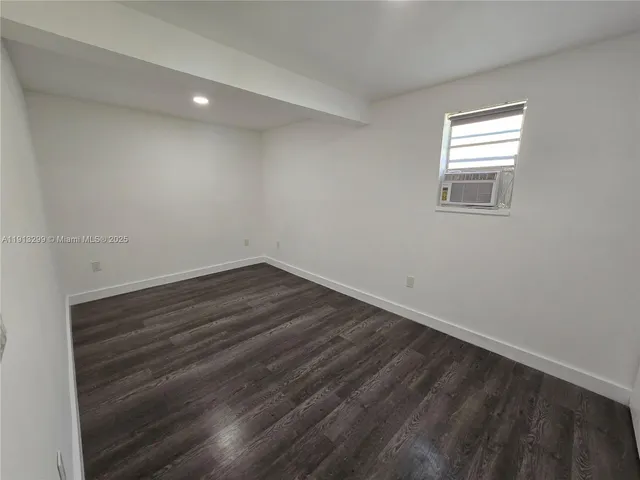 a bathroom with a shower a toilet and sink