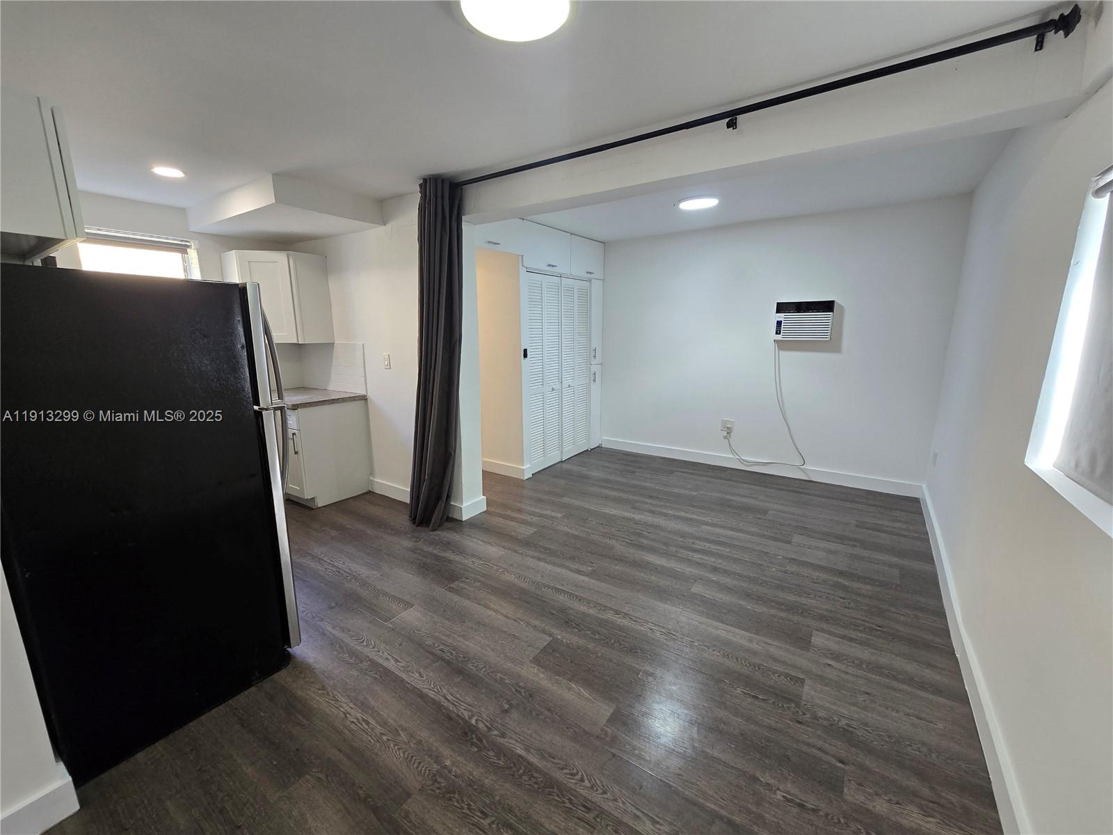 1629 Southwest 6th Street, Unit 13 Miami, FL 33135 - Photo 25 of 74 a view of empty room with wooden floor