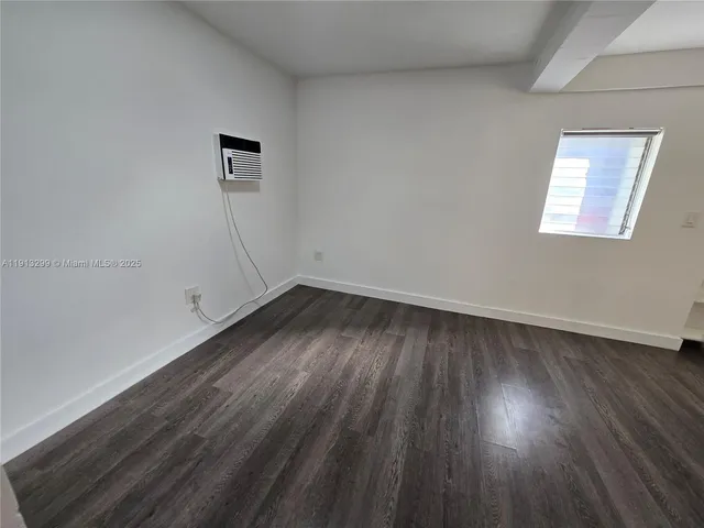 a kitchen with a refrigerator a sink a stove a microwave and cabinets