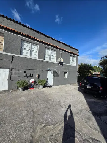 a bathroom with a shower a toilet and a sink