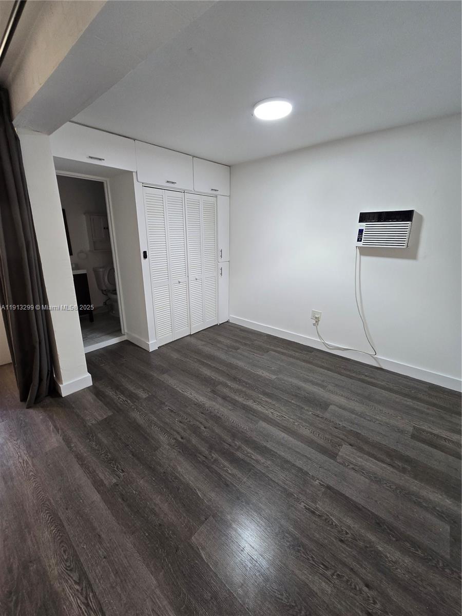 1629 Southwest 6th Street, Unit 13 Miami, FL 33135 - Photo 51 of 74 an empty room with wooden floor and entrance