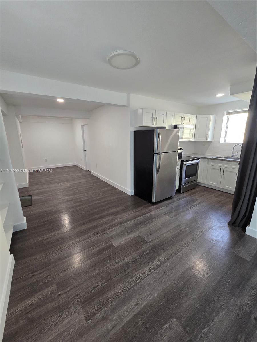 1629 Southwest 6th Street, Unit 13 Miami, FL 33135 - Photo 52 of 74 a view of a room with wooden floor