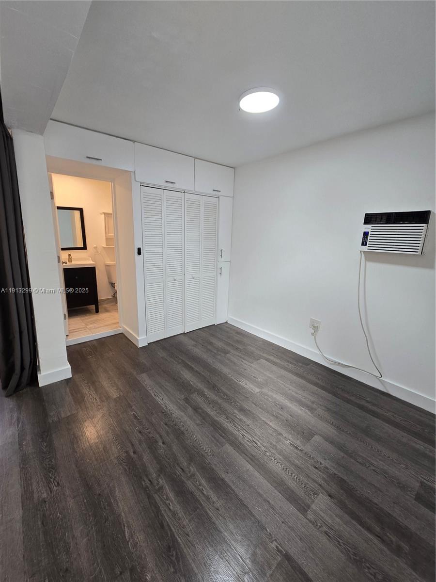 1629 Southwest 6th Street, Unit 13 Miami, FL 33135 - Photo 54 of 74 a view of a livingroom with wooden floor and electronic appliances