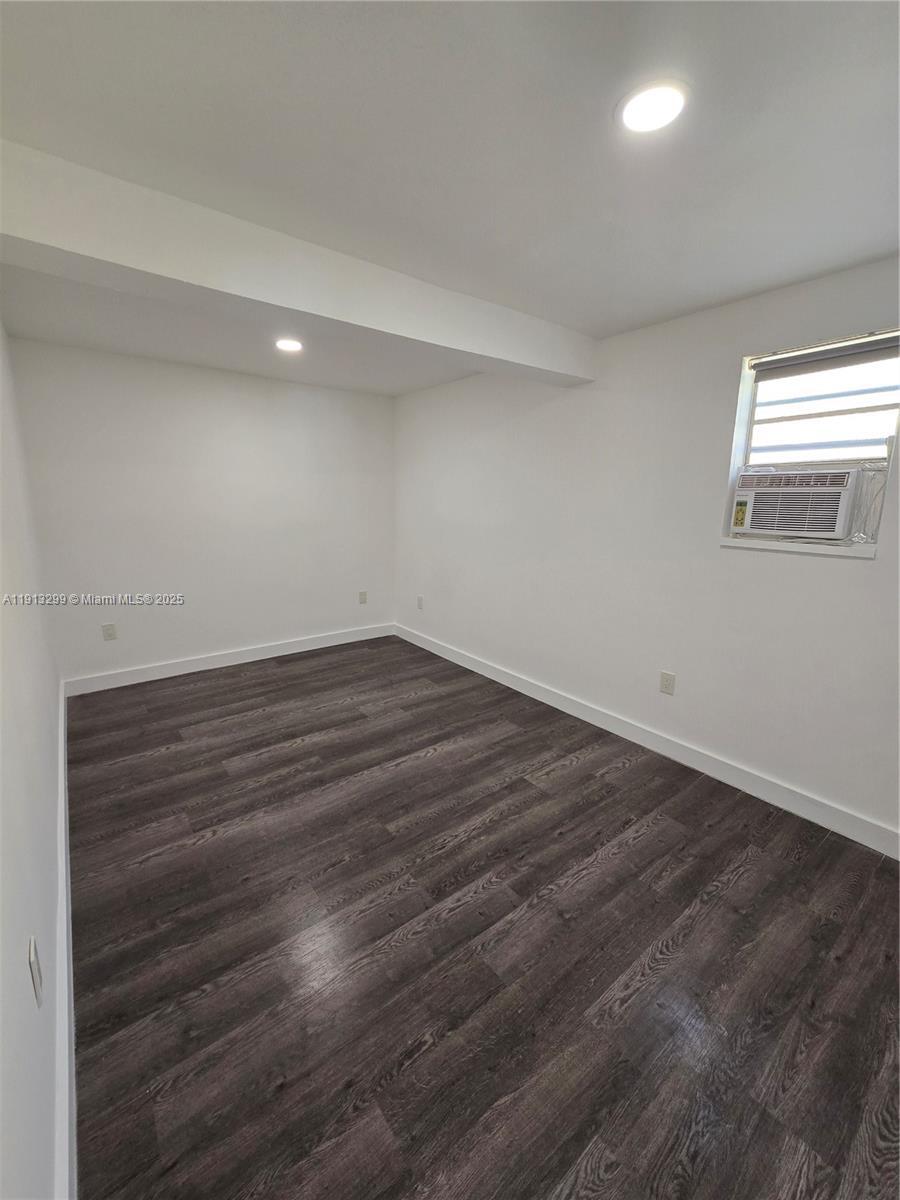 1629 Southwest 6th Street, Unit 13 Miami, FL 33135 - Photo 58 of 74 an empty room with wooden floor and windows