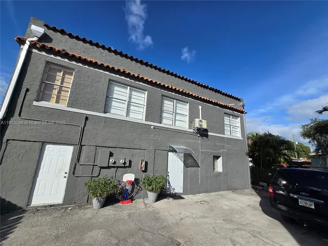 a kitchen with a refrigerator a sink a stove a microwave and cabinets