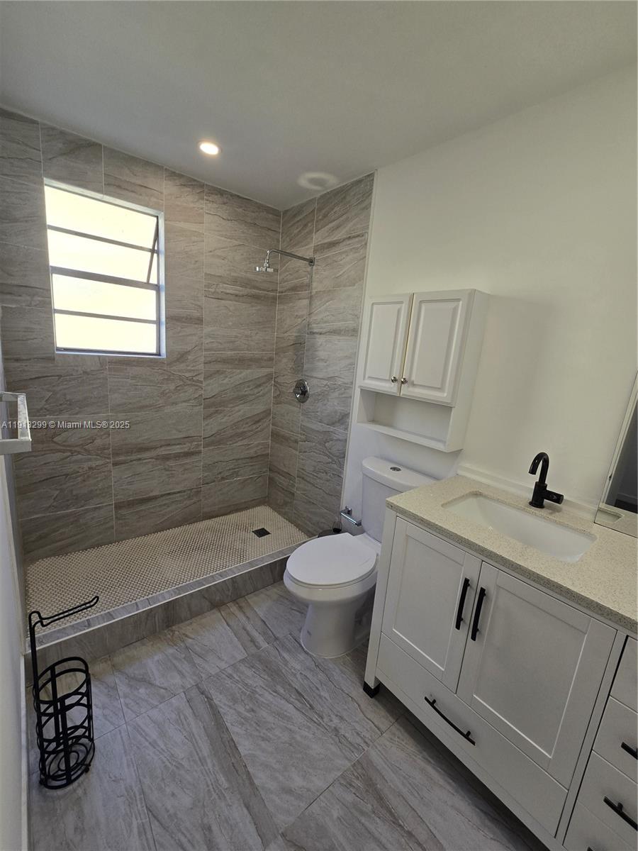 1629 Southwest 6th Street, Unit 13 Miami, FL 33135 - Photo 65 of 74 a bathroom with a sink a toilet and shower
