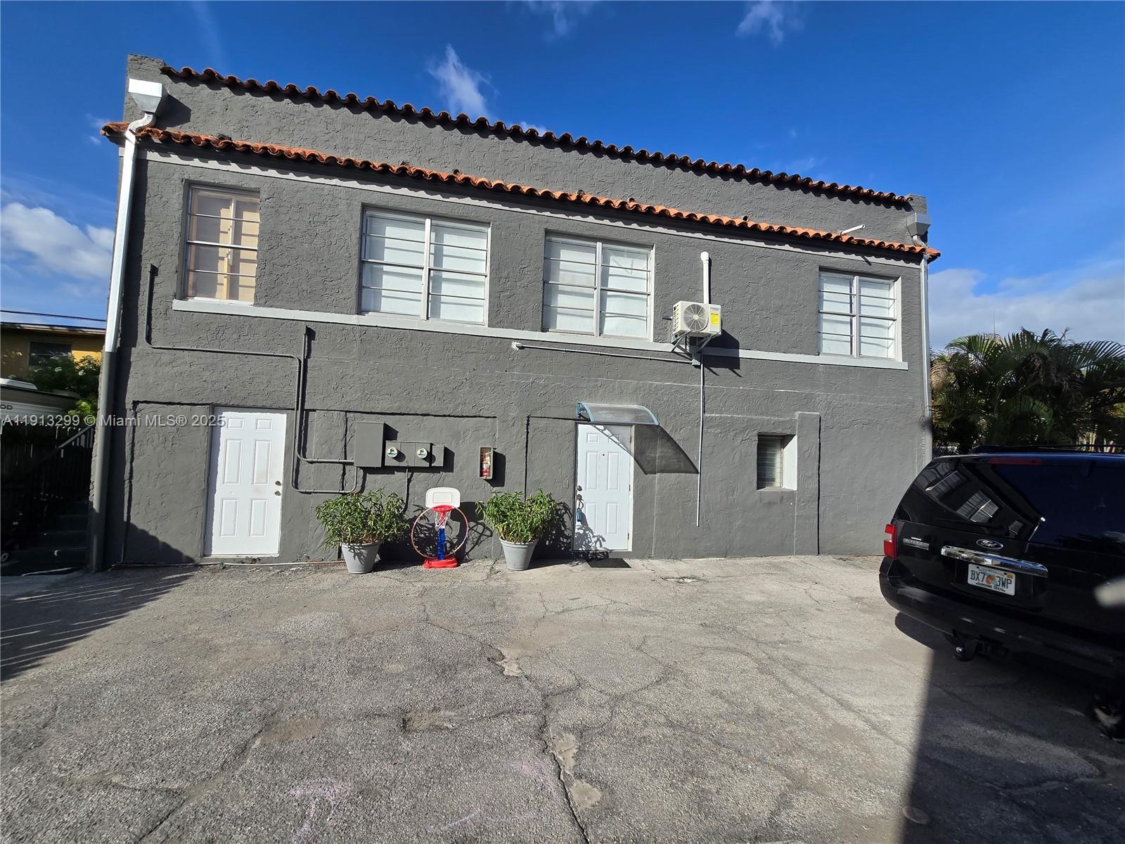1629 Southwest 6th Street, Unit 13 Miami, FL 33135 - Photo 7 of 74 a front view of a house with a yard