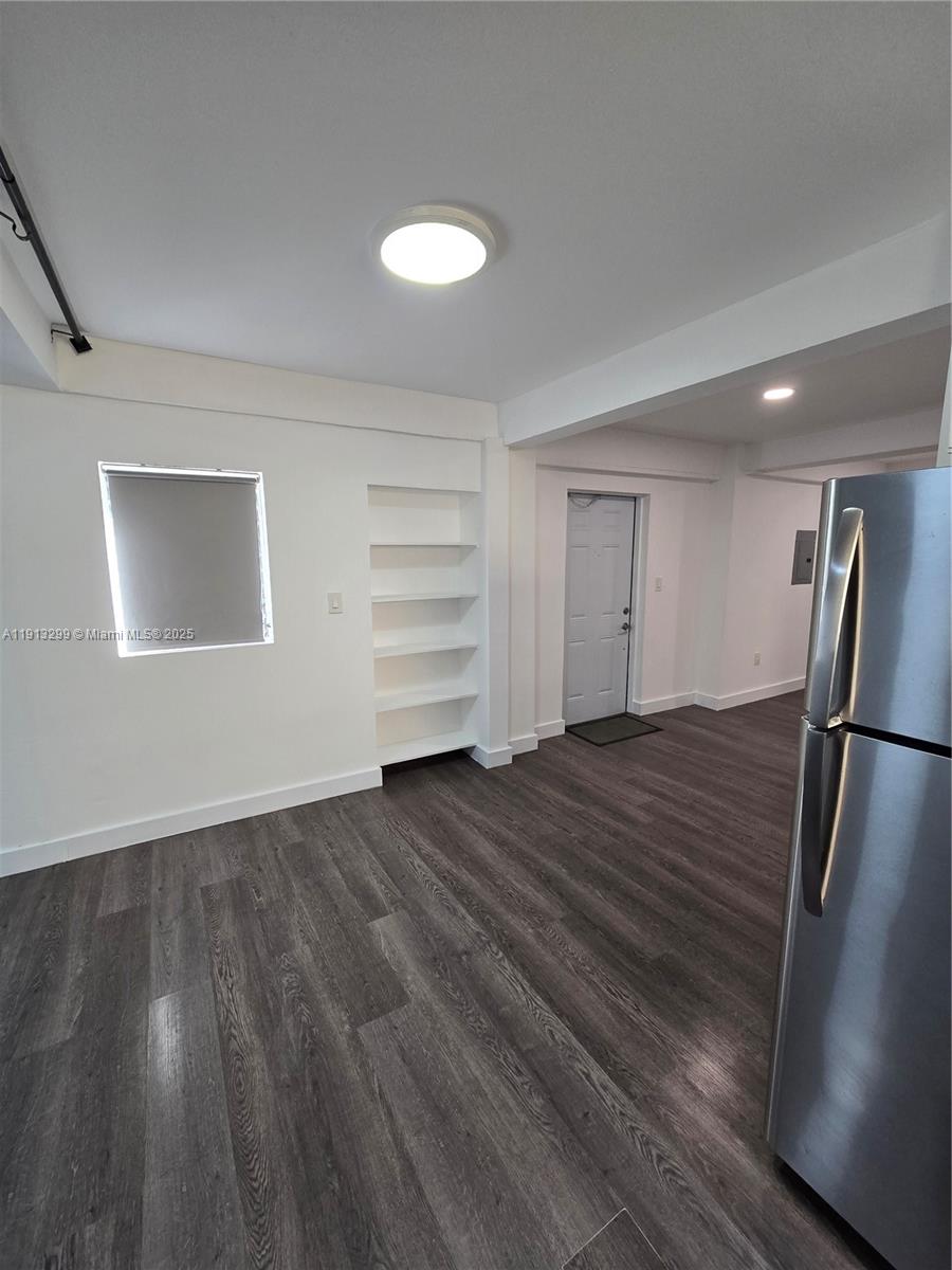 1629 Southwest 6th Street, Unit 13 Miami, FL 33135 - Photo 71 of 74 a view of empty room with wooden floor