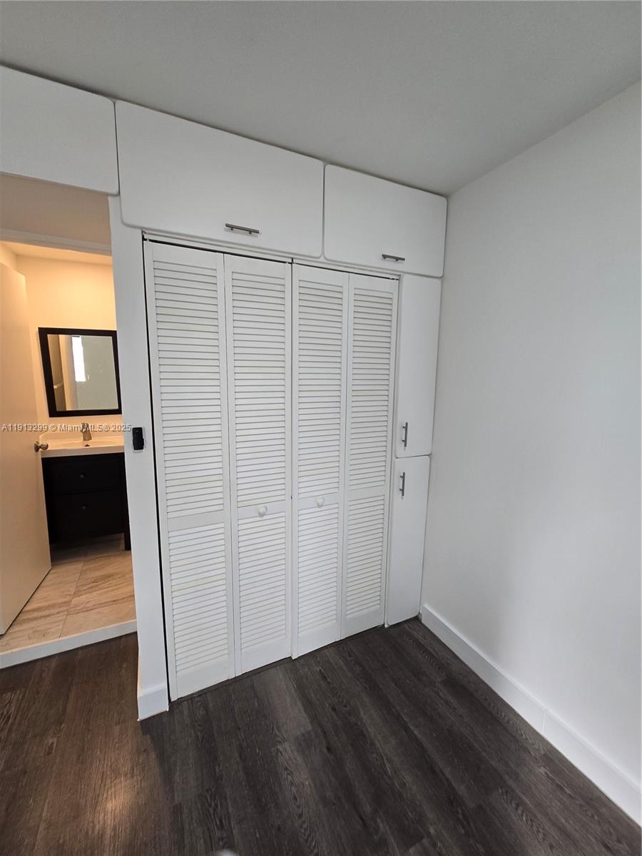 1629 Southwest 6th Street, Unit 13 Miami, FL 33135 - Photo 73 of 74 a view of a room with wooden floor and staircase