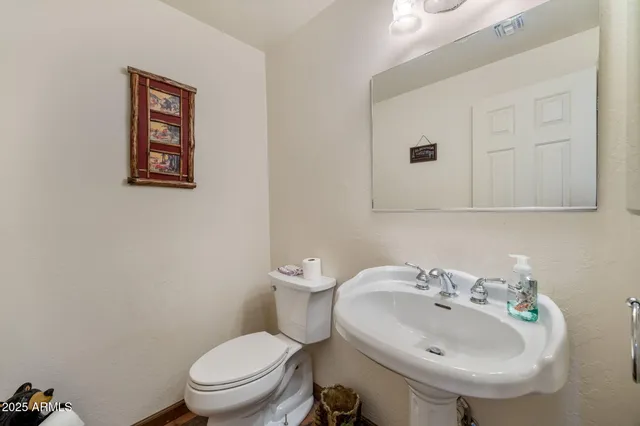 a kitchen with stainless steel appliances granite countertop sink stove and refrigerator