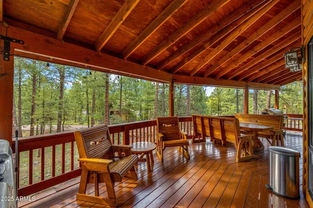 a bathroom with a sink a toilet a mirror a vanity and shower