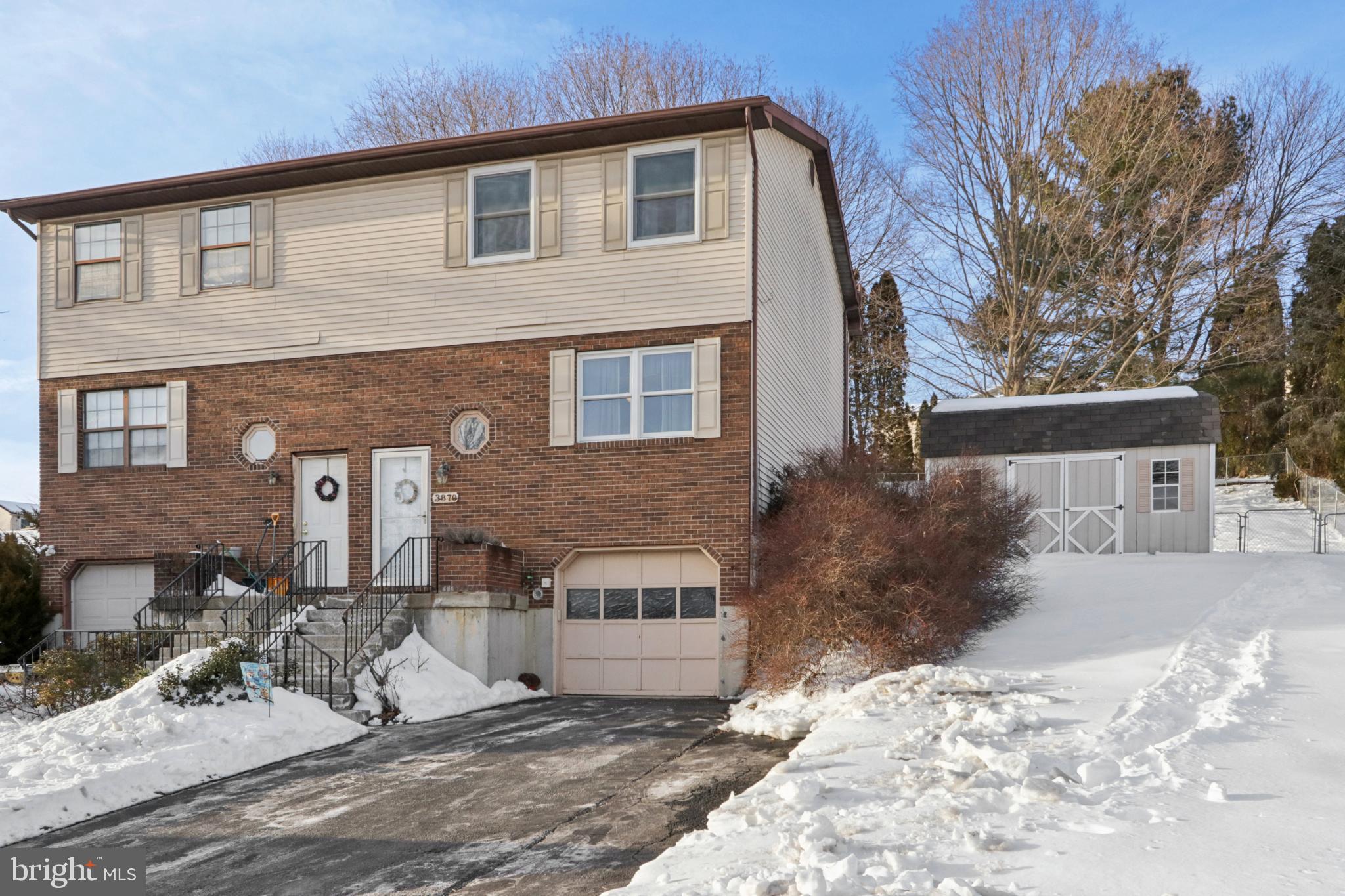 Duplex with large, fenced backyard and shed.