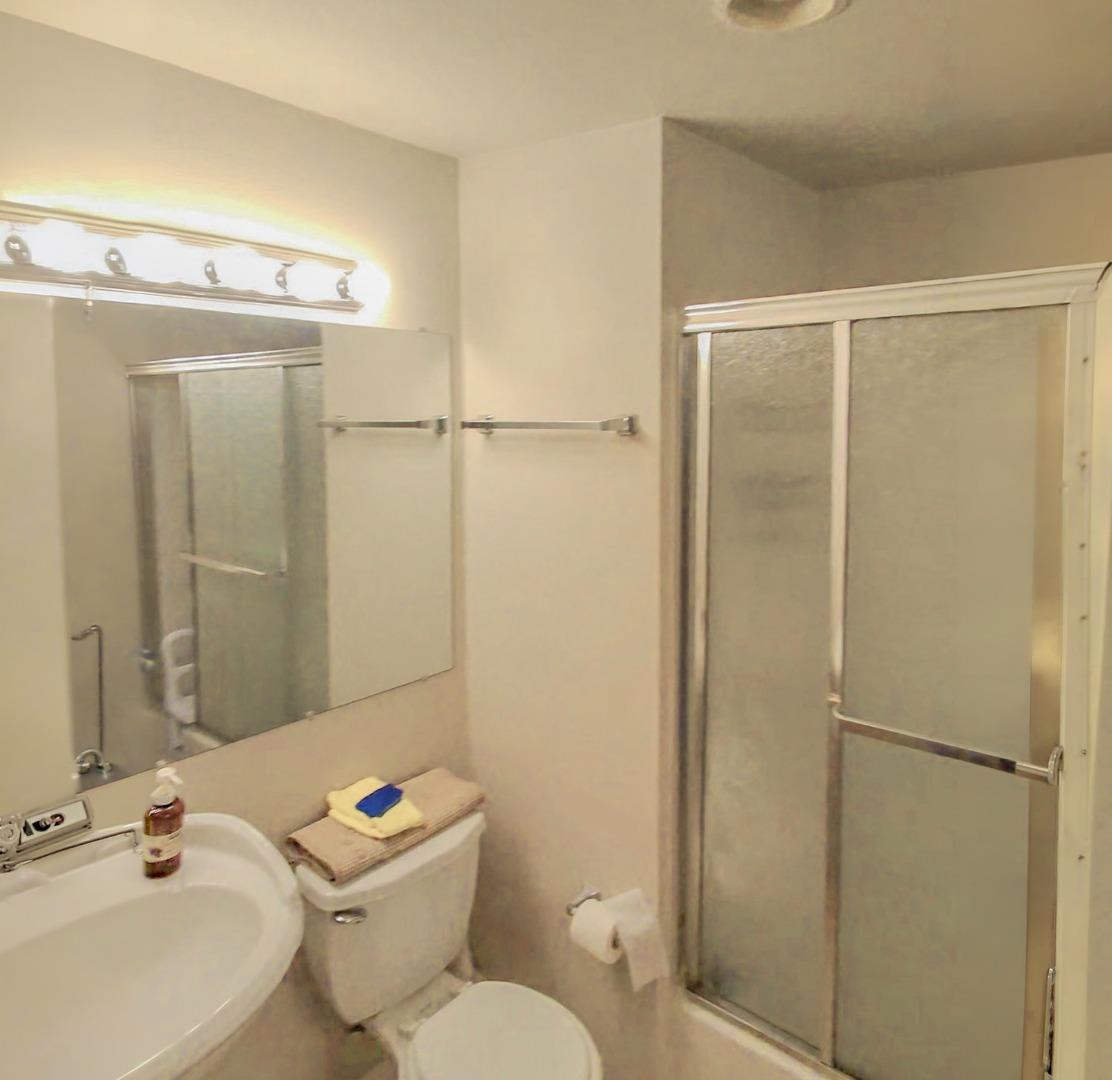 25583 Spring Drive Hayward, CA 94542 - Photo 13 of 27 a white toilet sitting next to a bathroom sink