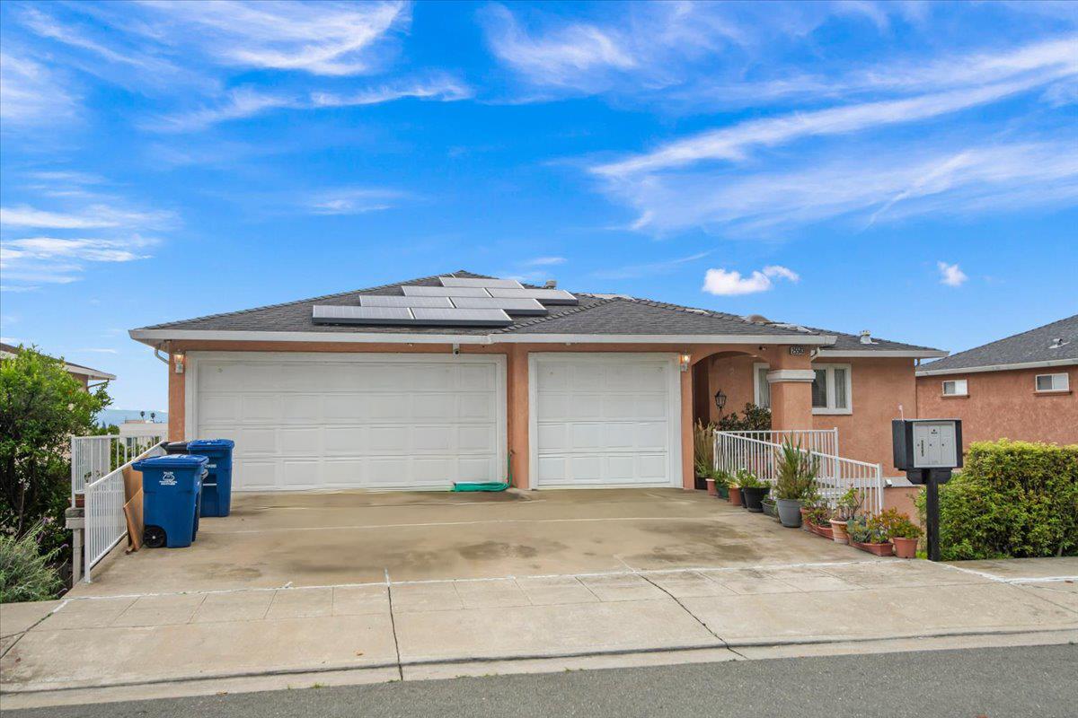 25583 Spring Drive Hayward, CA 94542 - Photo 2 of 27 a front view of a house with a garage