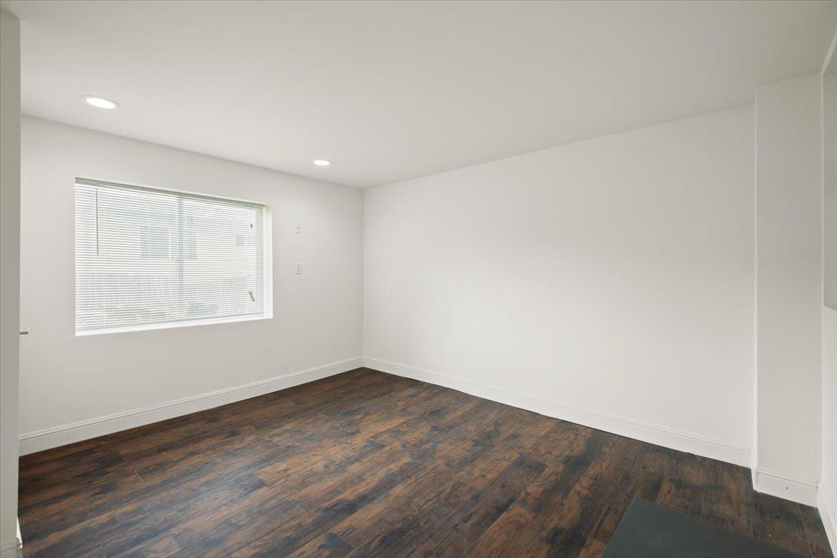 25583 Spring Drive Hayward, CA 94542 - Photo 27 of 27 an empty room with wooden floor and windows