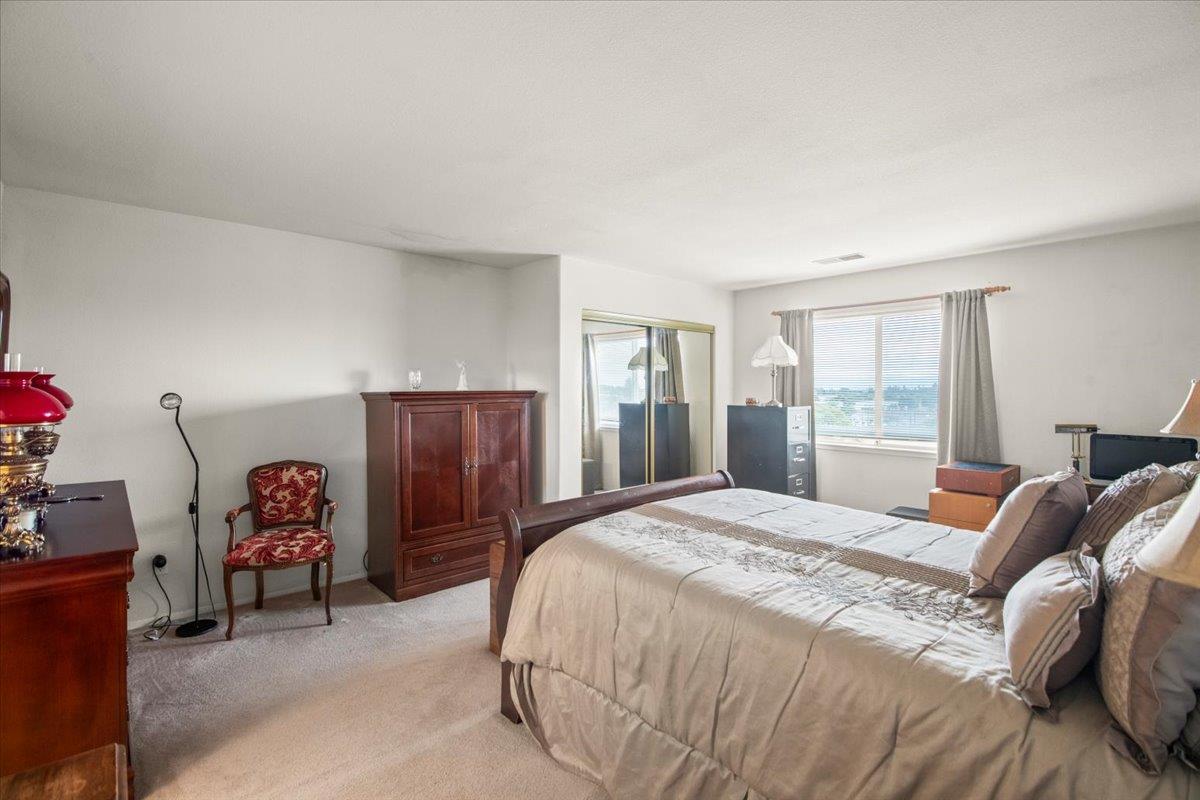25583 Spring Drive Hayward, CA 94542 - Photo 8 of 27 a bedroom with a bed and a closet