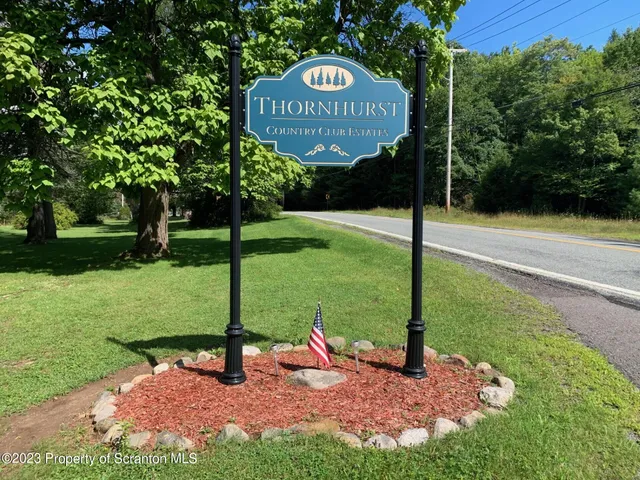 a view of a park with welcome board