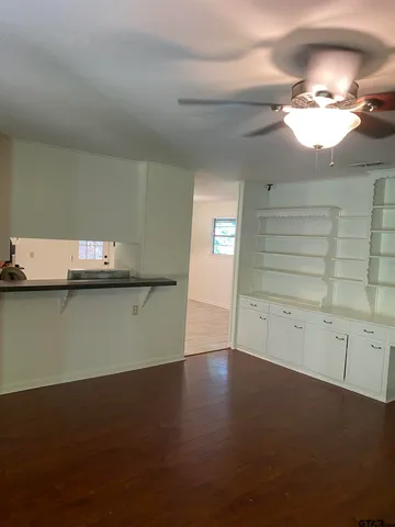 a view of front door of house with a yard