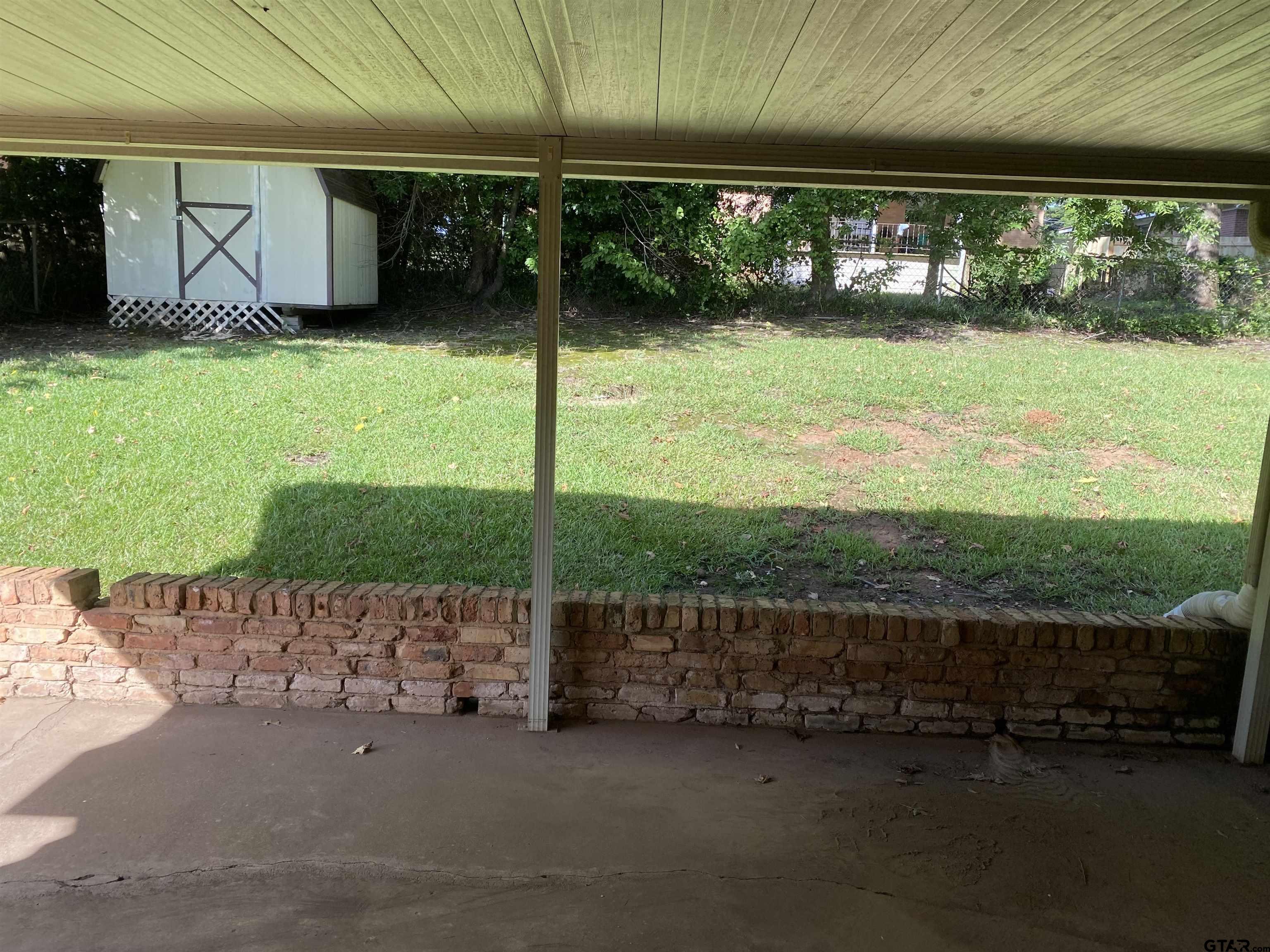 2613 Chelsea Drive Tyler, TX 75701 - Photo 15 of 33 a view of a back yard of the house