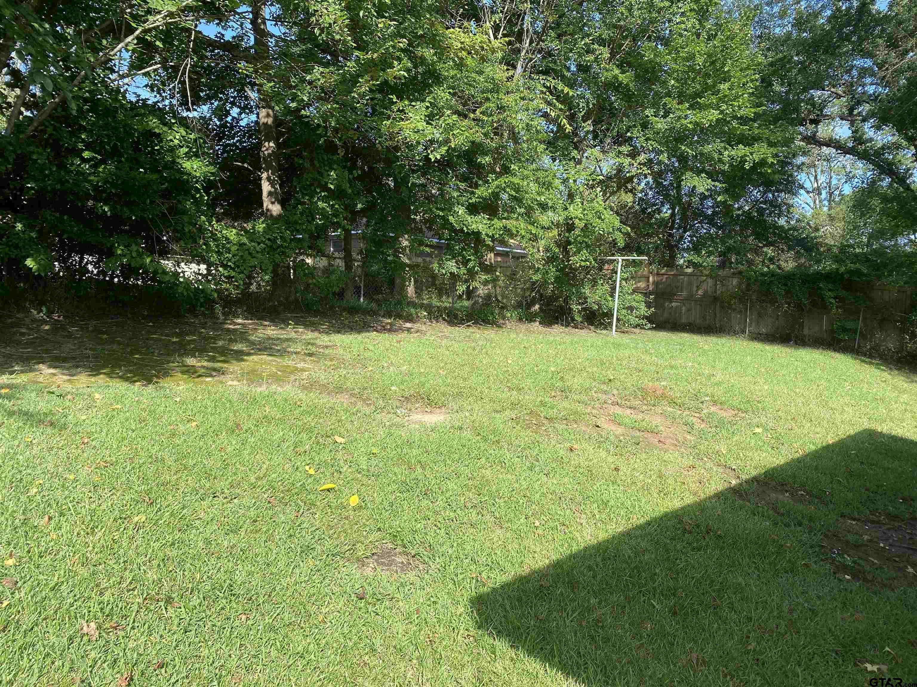2613 Chelsea Drive Tyler, TX 75701 - Photo 17 of 33 a view of a field with a tree