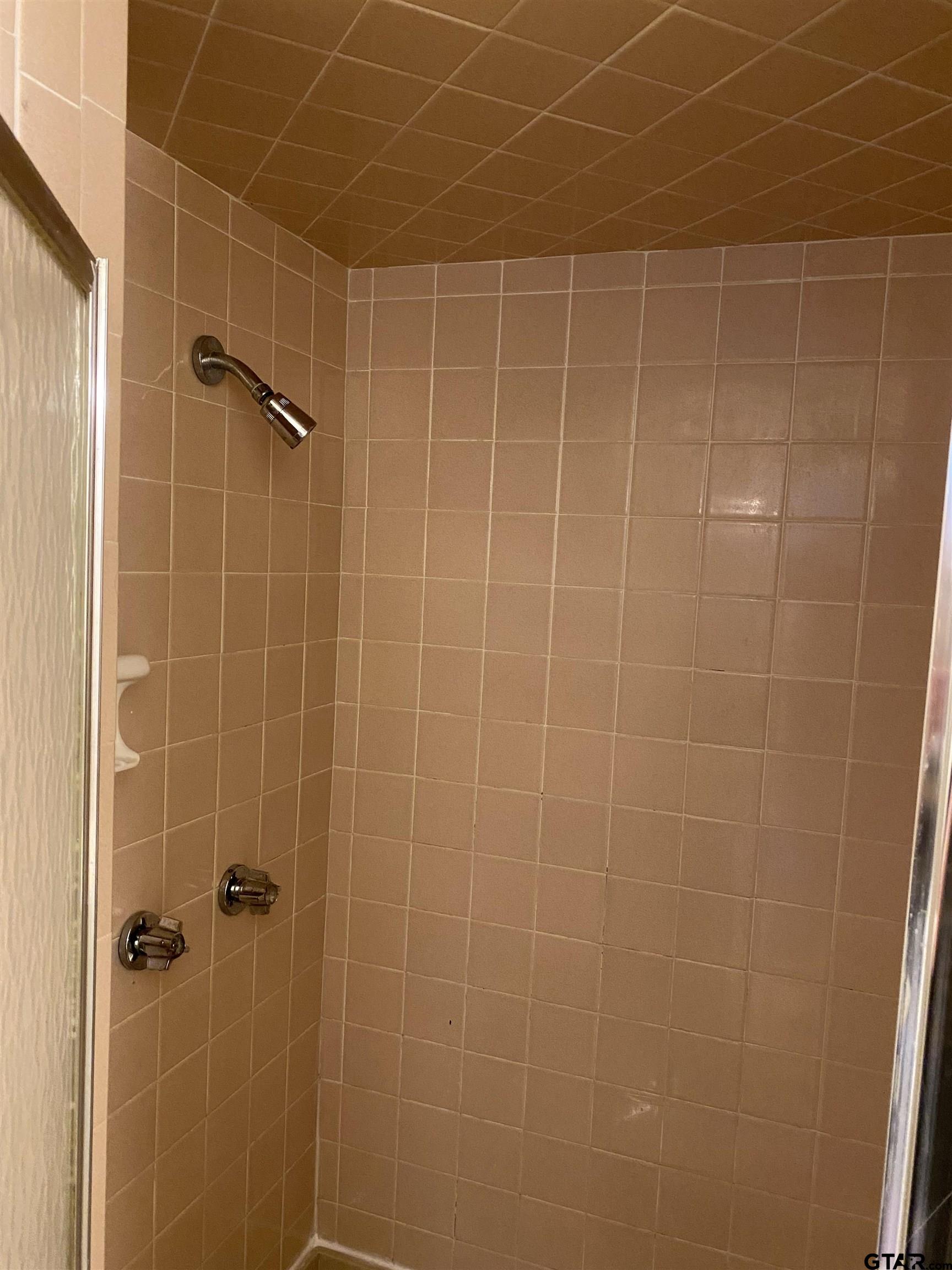 2613 Chelsea Drive Tyler, TX 75701 - Photo 26 of 33 a bathroom with a shower