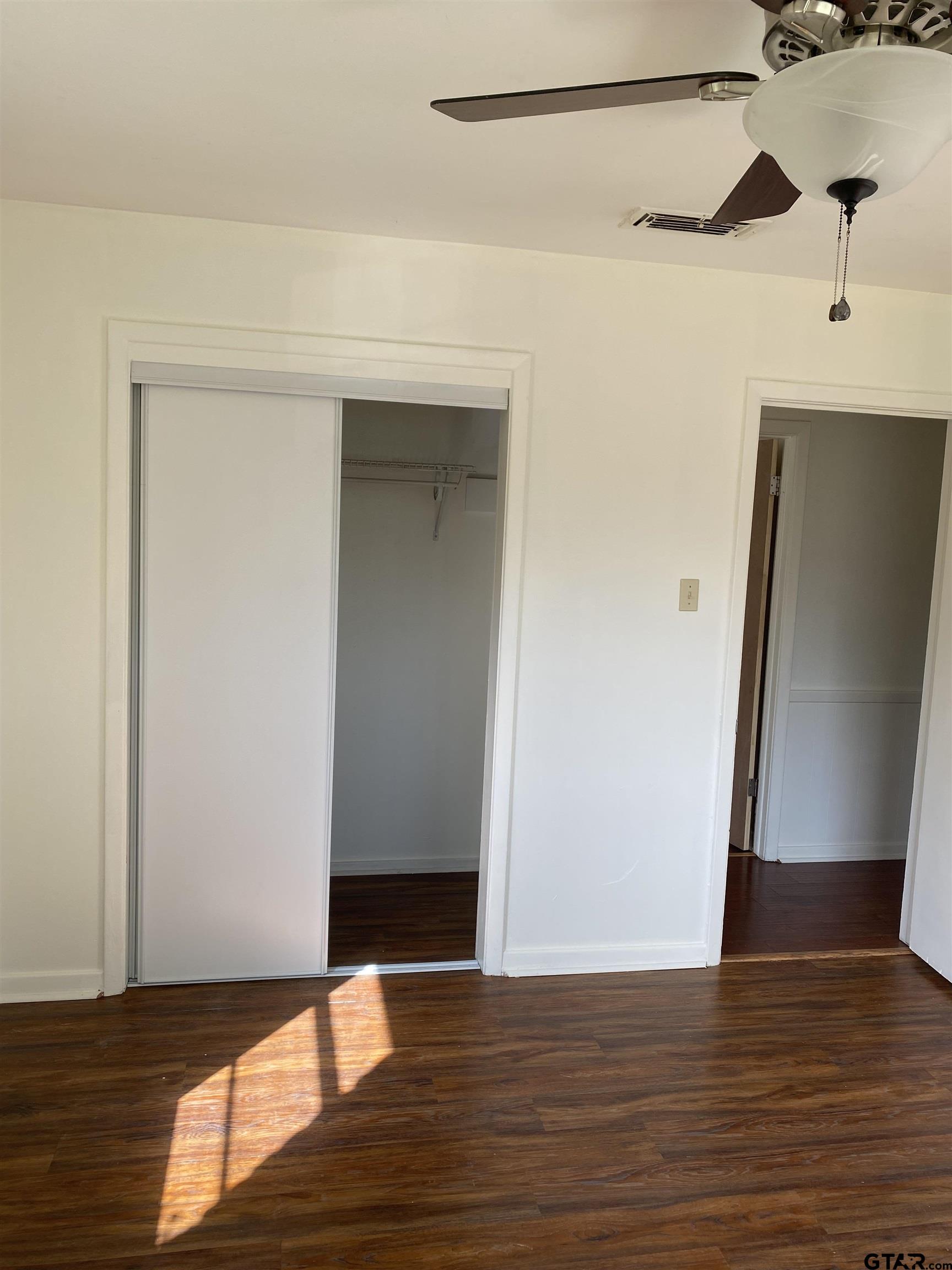 2613 Chelsea Drive Tyler, TX 75701 - Photo 28 of 33 a view of empty room with wooden floor