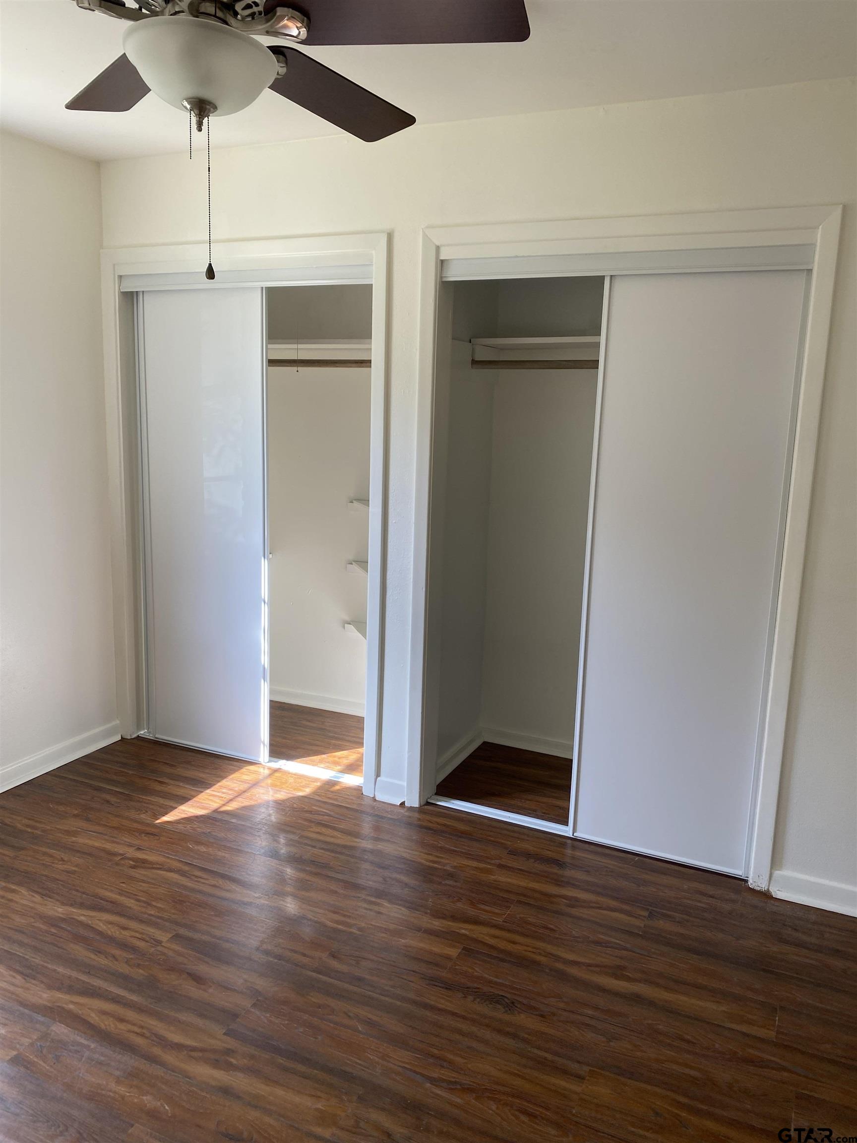 2613 Chelsea Drive Tyler, TX 75701 - Photo 29 of 33 a view of an empty room with wooden floor