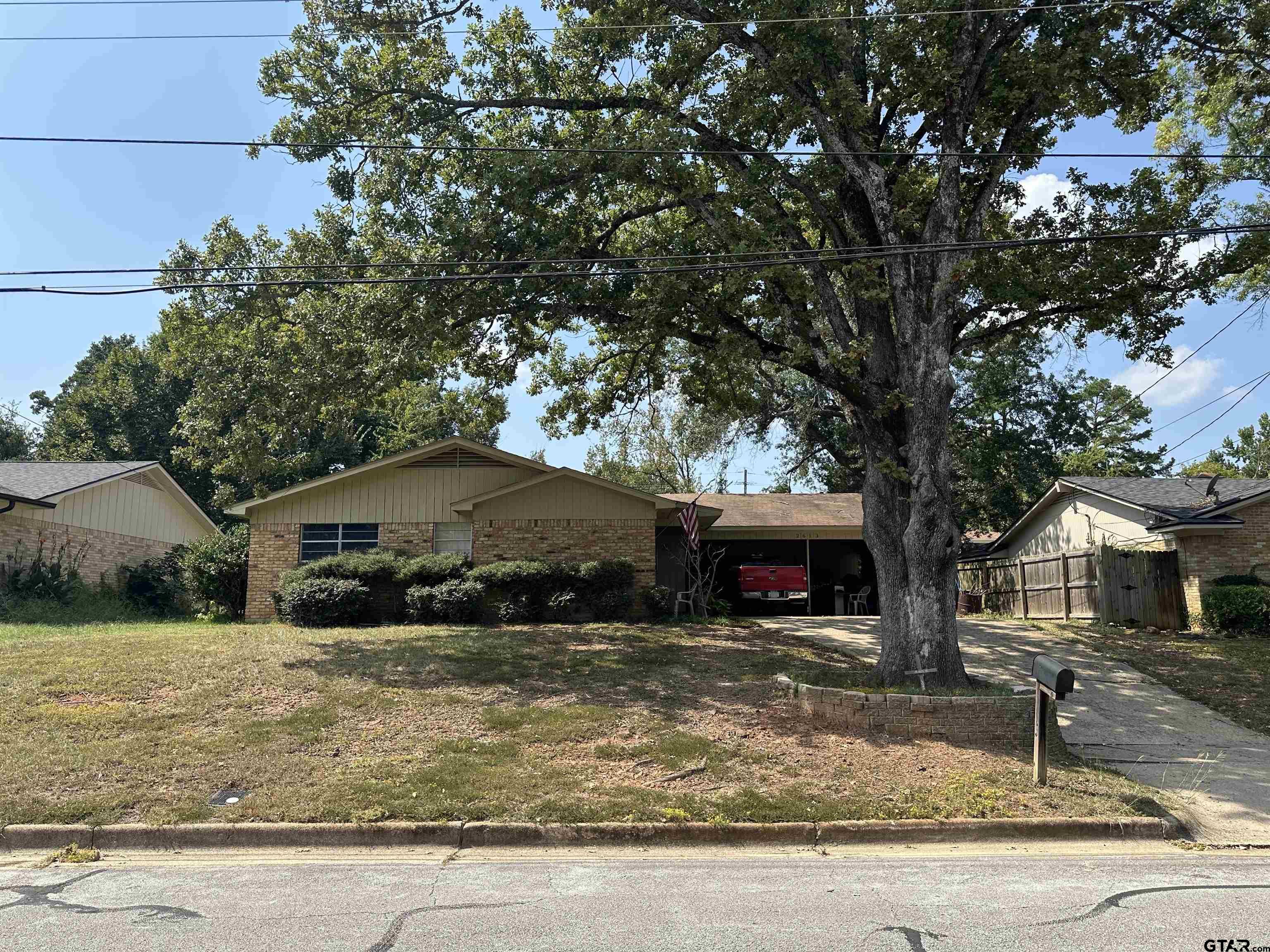 2613 Chelsea Drive Tyler, TX 75701 - Photo 3 of 33 a front view of a house with garden