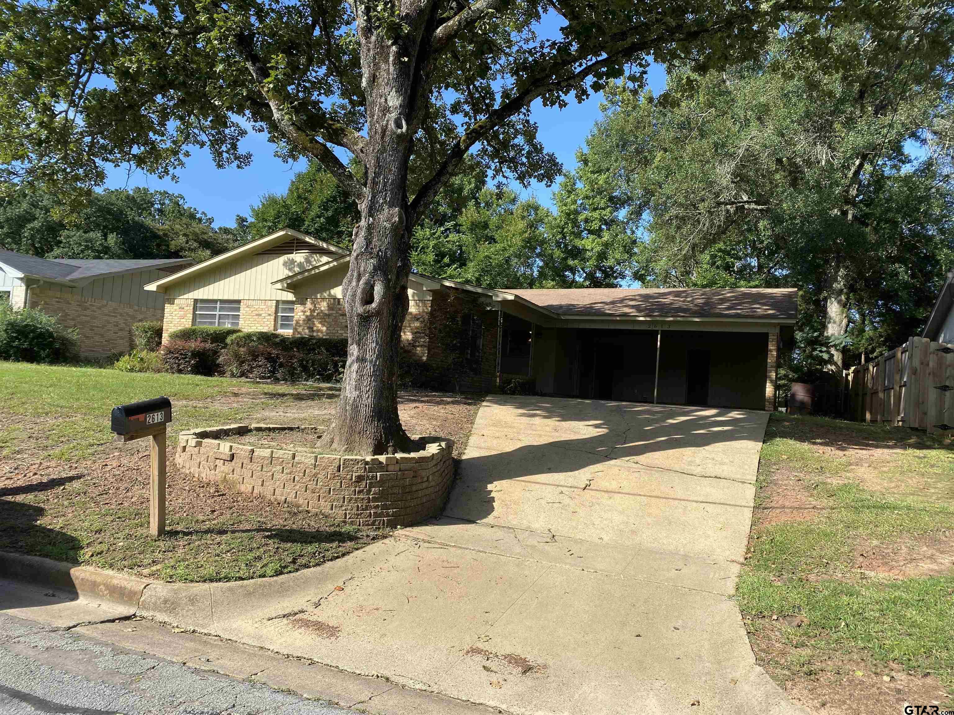 2613 Chelsea Drive Tyler, TX 75701 - Photo 5 of 33 a front view of a house with garden