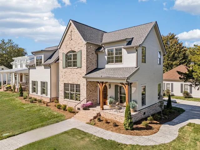 a front view of a house with a yard table and chairs