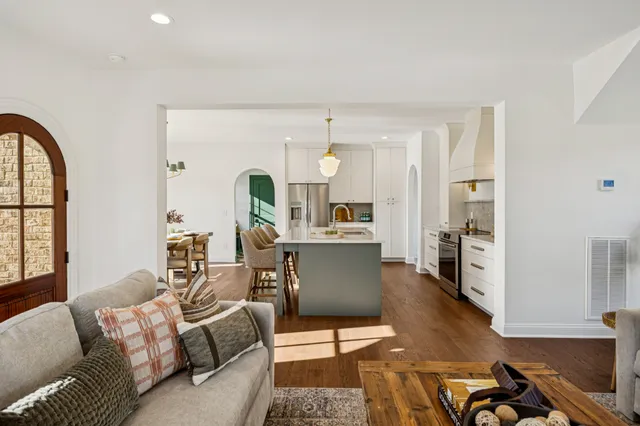 a living room with furniture window and wooden floor