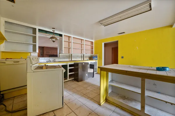 a kitchen with stainless steel appliances granite countertop a stove and a refrigerator
