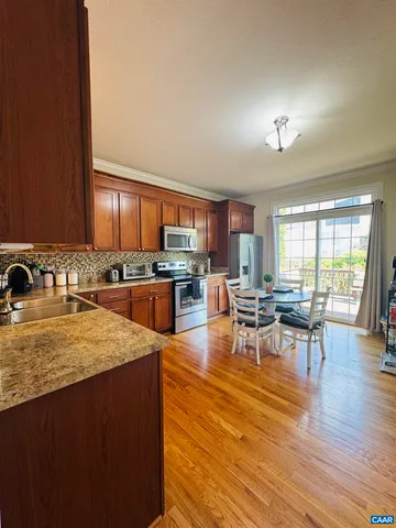 a view of entryway with wooden floor and stairs