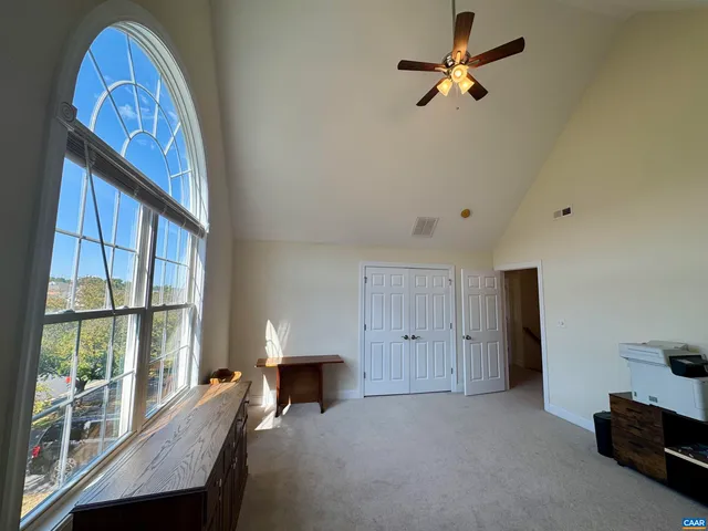 a aerial view of a house with a yard and sitting space