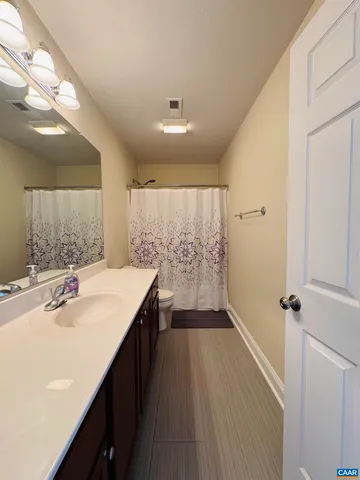 an aerial view of residential houses with outdoor space and river