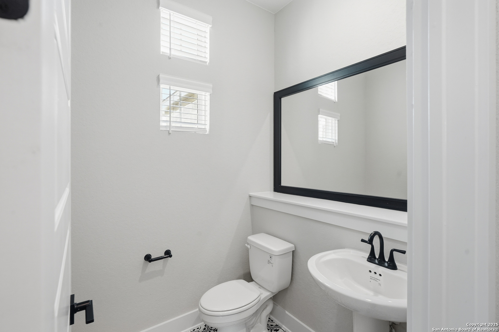 326 Vamanos Boerne, TX 78006 - Photo 11 of 55 a bathroom with a toilet a sink and mirror