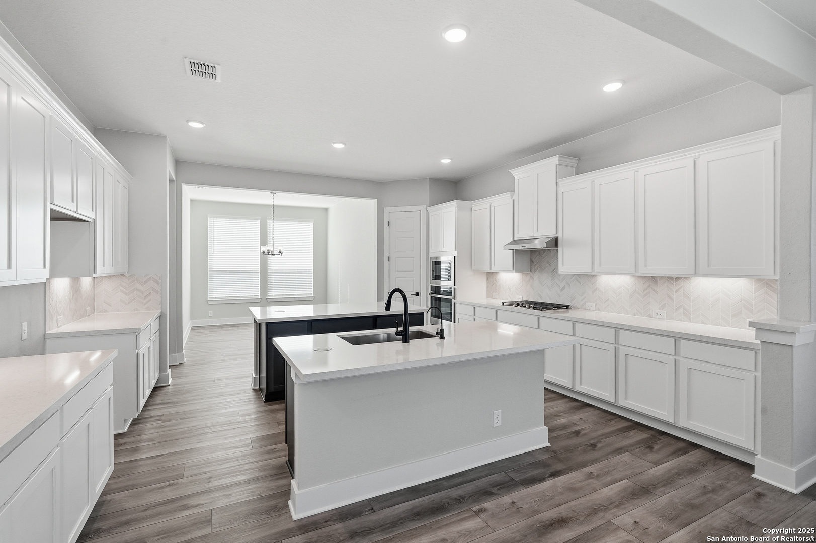 326 Vamanos Boerne, TX 78006 - Photo 20 of 55 a kitchen with stainless steel appliances granite countertop a sink stove and refrigerator