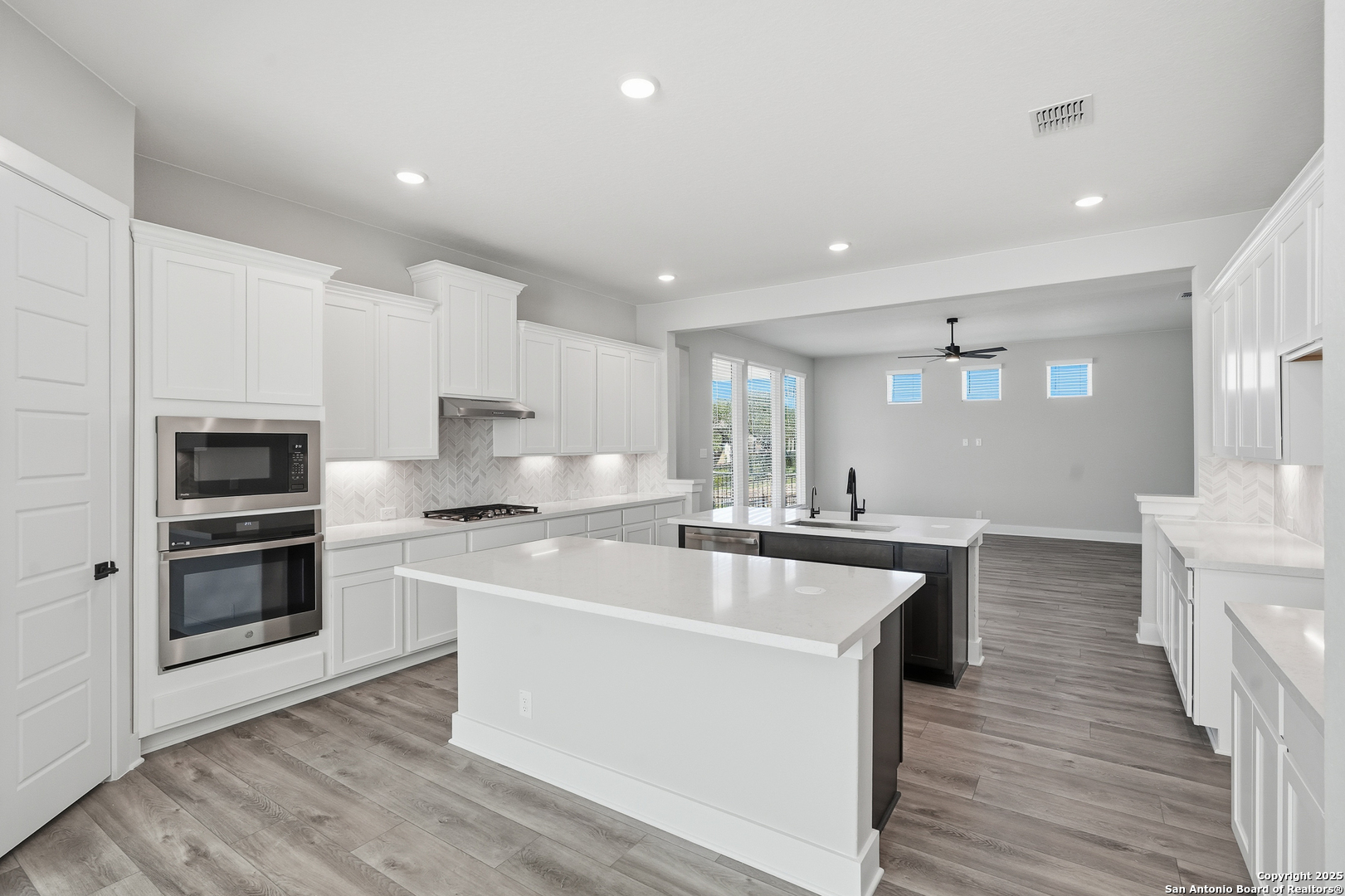 326 Vamanos Boerne, TX 78006 - Photo 21 of 55 a kitchen with stainless steel appliances a sink stove and refrigerator