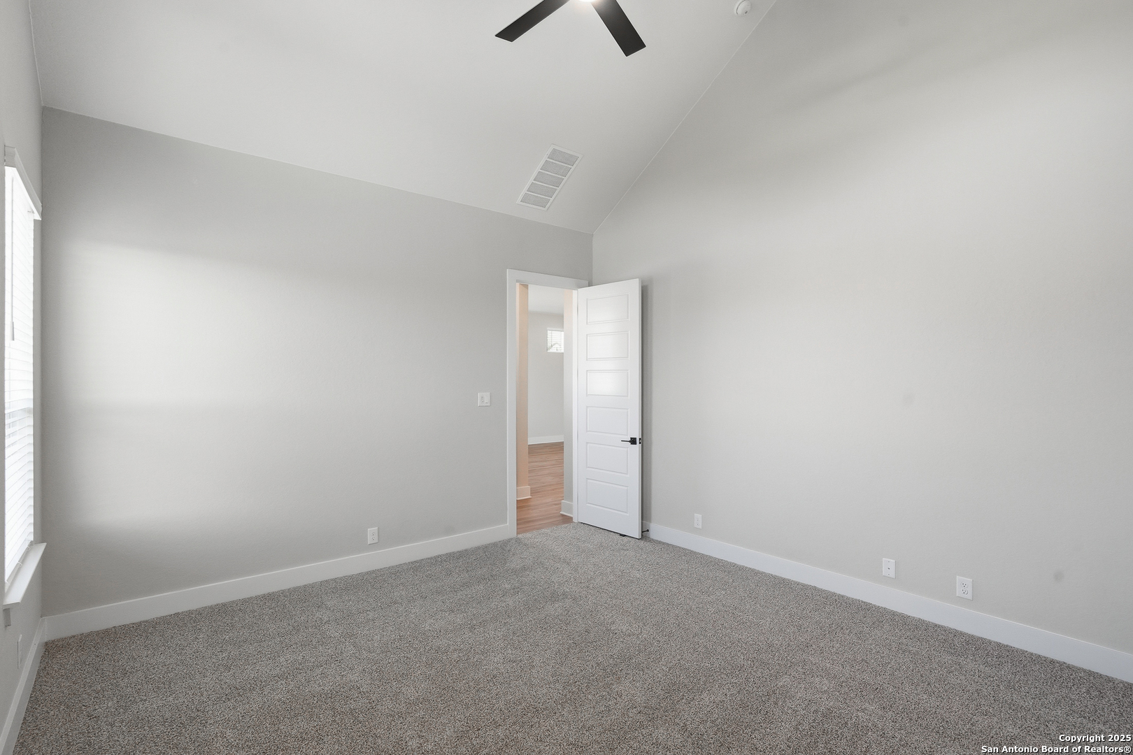 326 Vamanos Boerne, TX 78006 - Photo 24 of 55 an empty room with ceiling fan and window