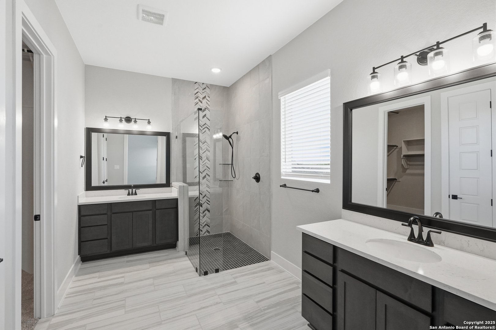 326 Vamanos Boerne, TX 78006 - Photo 25 of 55 a bathroom with a double vanity sink mirror and shower