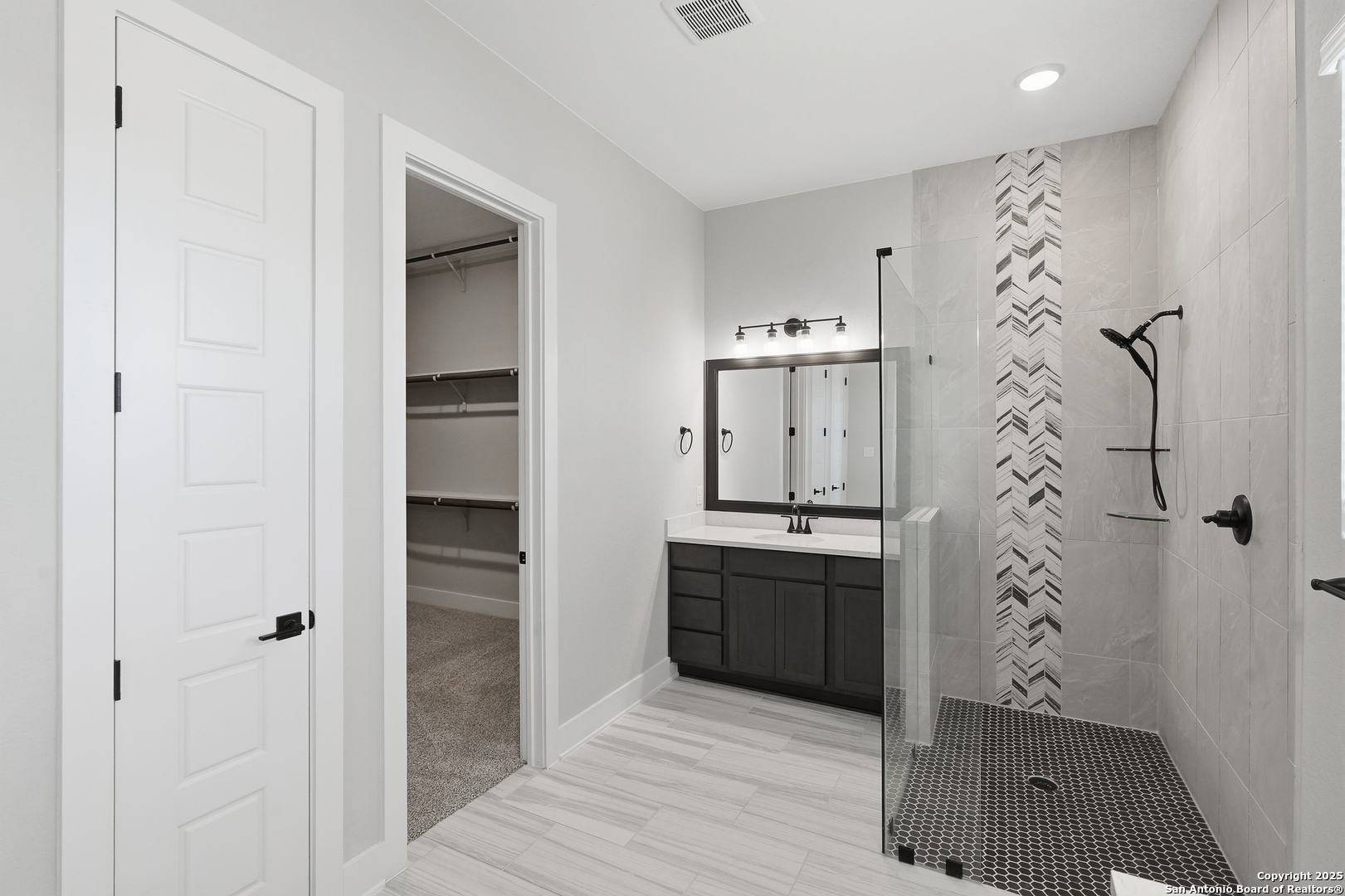 326 Vamanos Boerne, TX 78006 - Photo 26 of 55 a bathroom with a bathtub and a shower