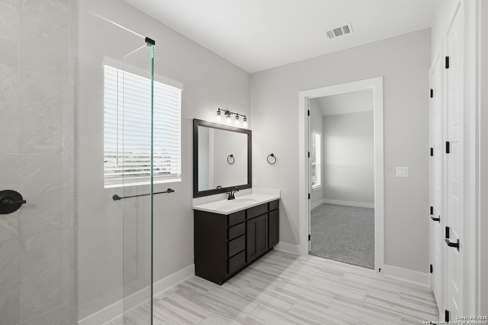 326 Vamanos Boerne, TX 78006 - Photo 27 of 55 a view of a bathroom from the hallway